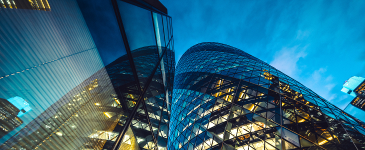 image of glass commercial building in the evening